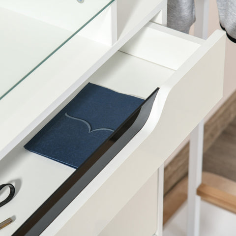 Dark blue leather notebook with silver wave design placed on a homcom shoe cabinet with two flip doors and slide out drawer