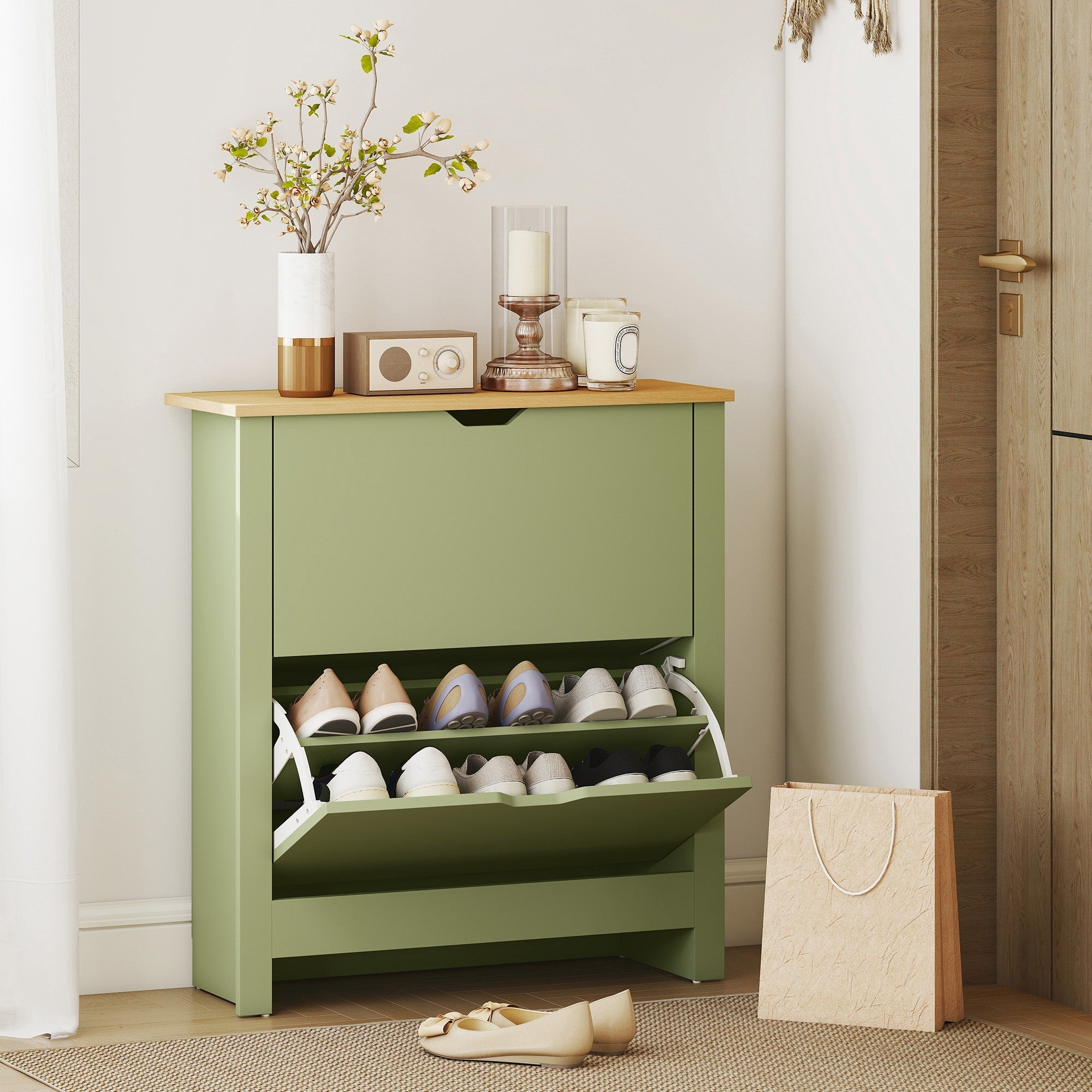 A sage green particle board shoe cabinet with light wood top and two pull-out shelves for 12 pairs 72l x 26dcm
