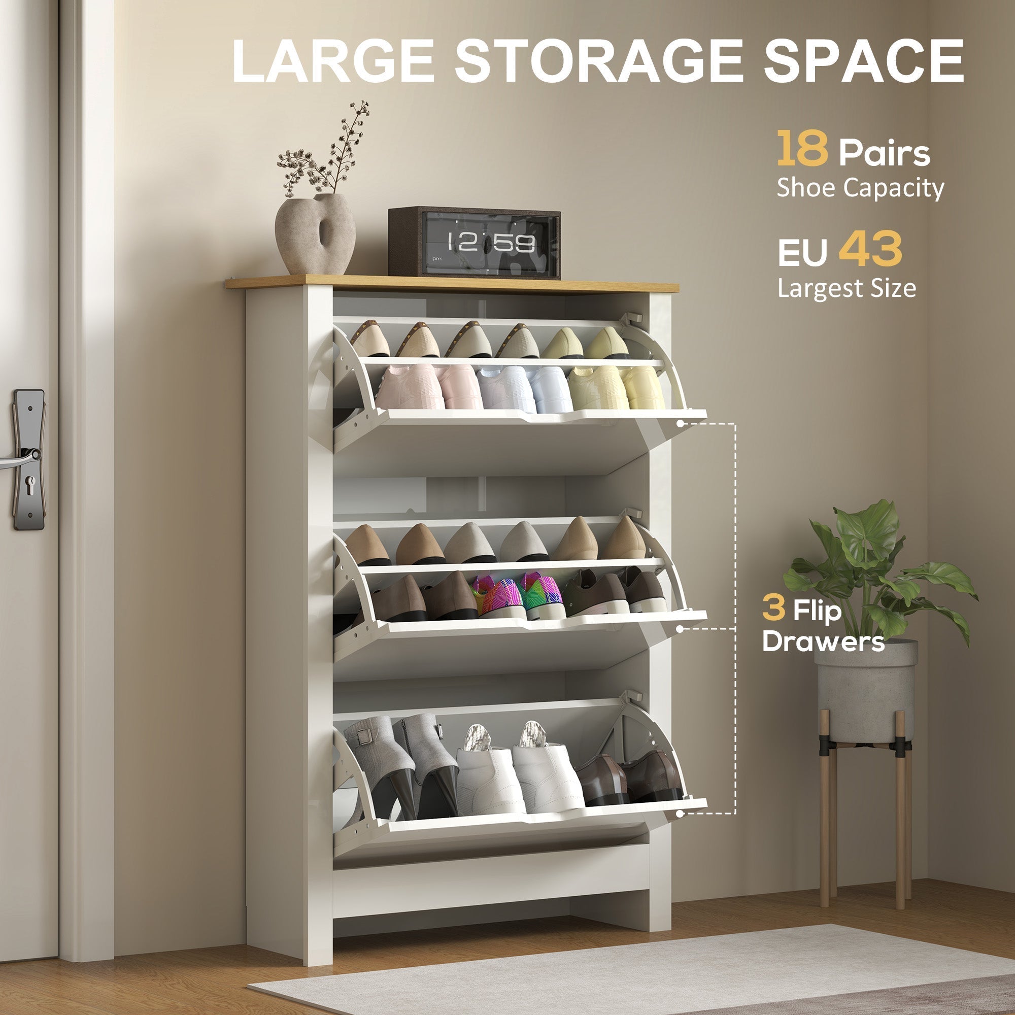 White wooden shoe cabinet with three flip drawers and top shelf holding vase and clock made of particle board with anti-tipping straps included