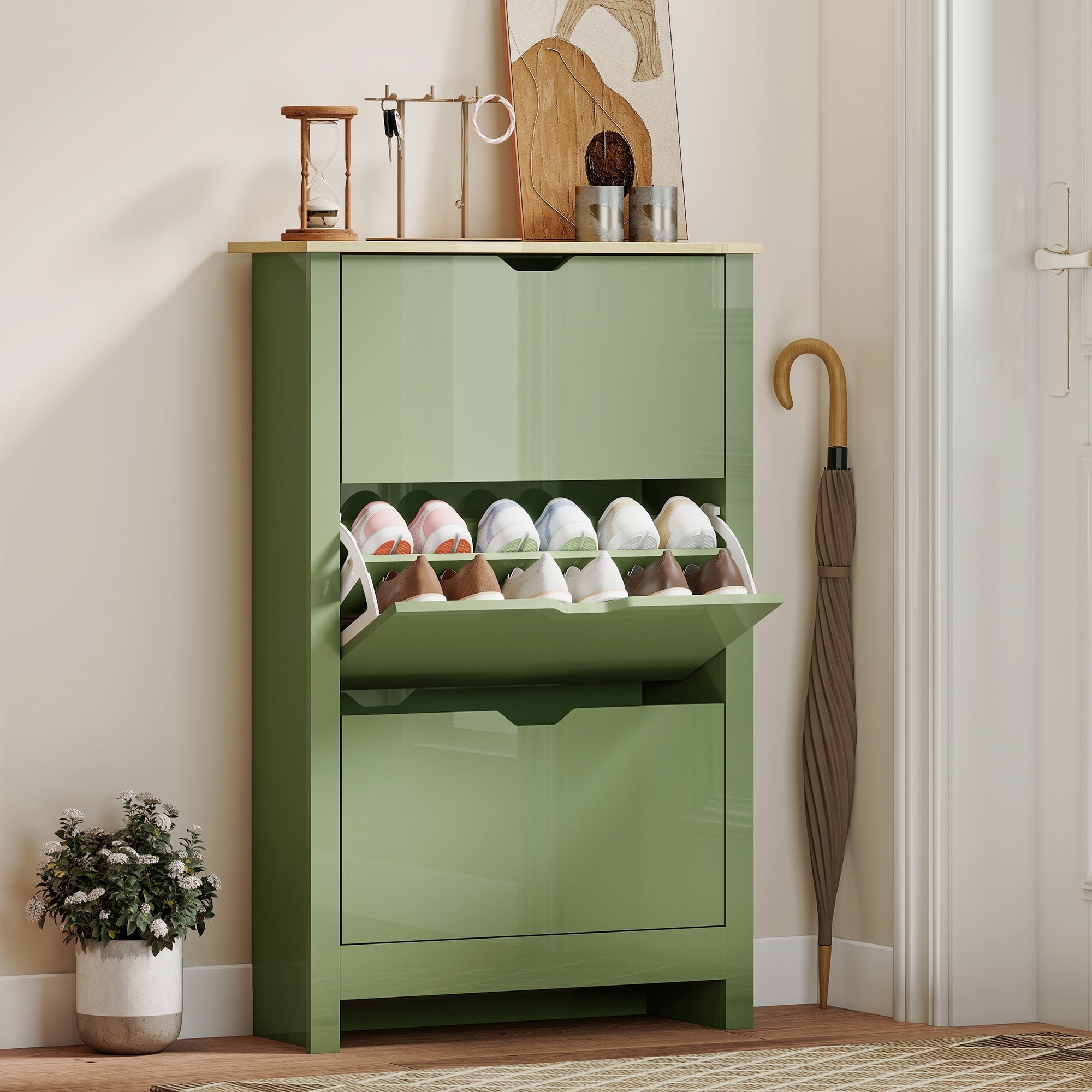 Modern matte high gloss green shoe cabinet made of particle board with pull-out shelf holding white and brown shoes