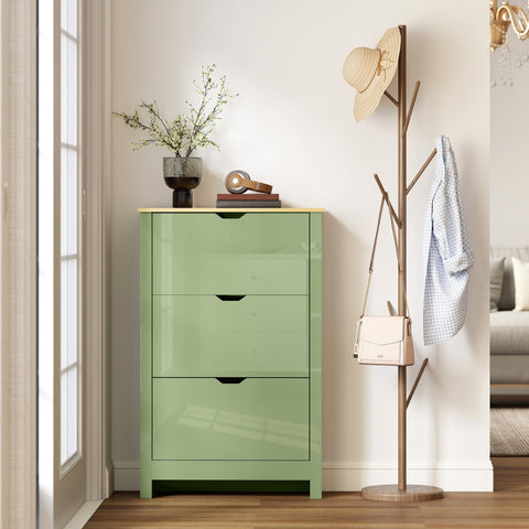 A sleek high gloss green shoe cabinet made of particle board with three flip drawers and minimalist black handles
