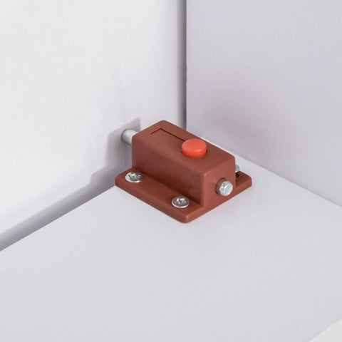 Brown plastic cabinet latch with orange button and silver screws on HOMCOM white folding dining table for small space