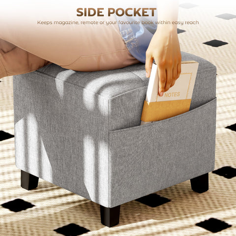 Gray linen fabric storage ottoman with side pocket and rubber wood legs for living room and bedroom use