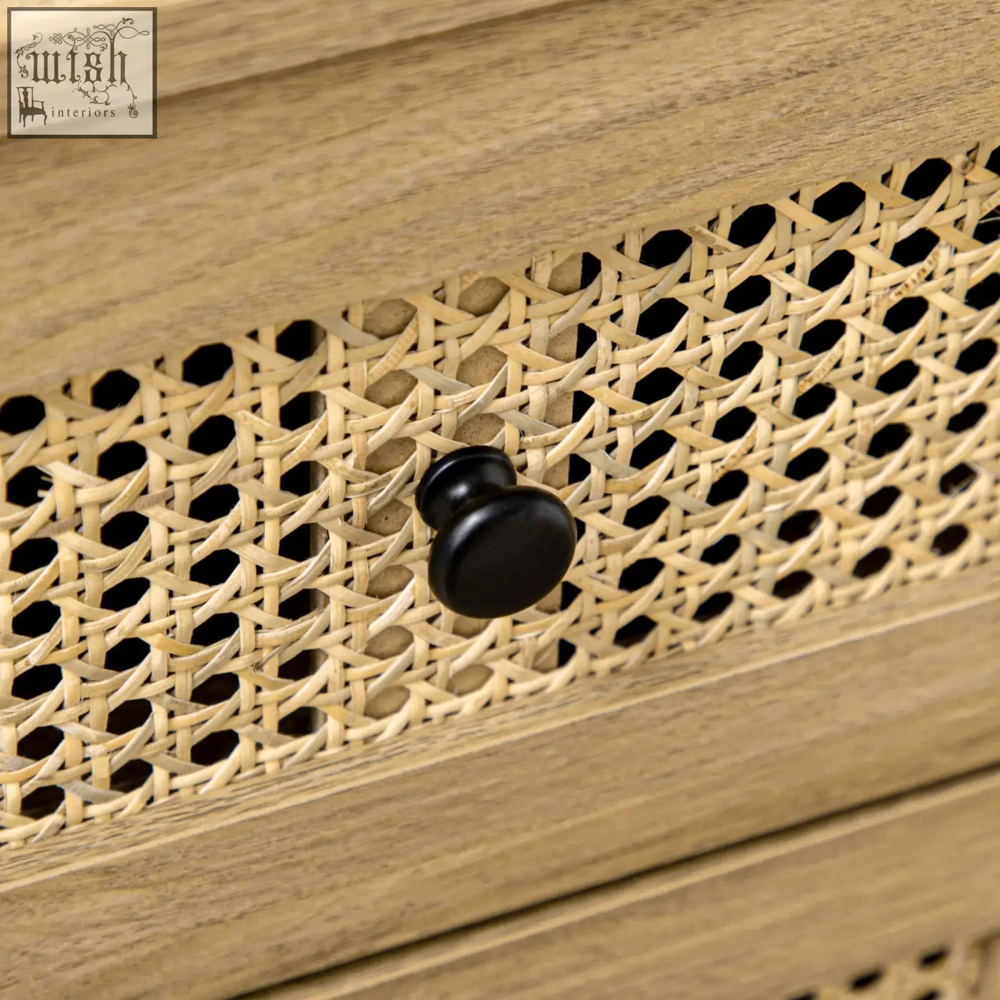Black round knob on light wood particle board drawer front with woven cane on homcom four drawers cabinet with anti-tipping straps