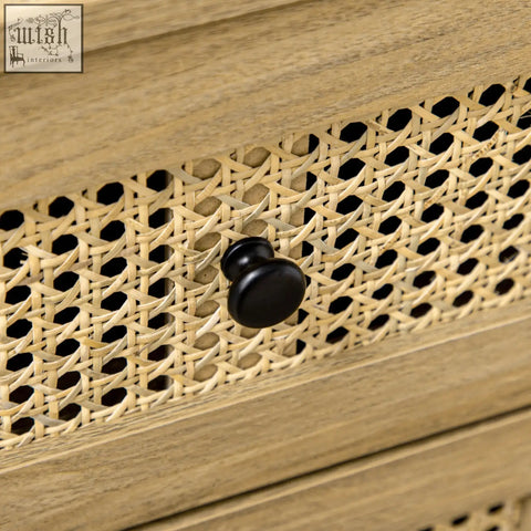 Black round knob on light wood particle board drawer front with woven cane on homcom four drawers cabinet with anti-tipping straps