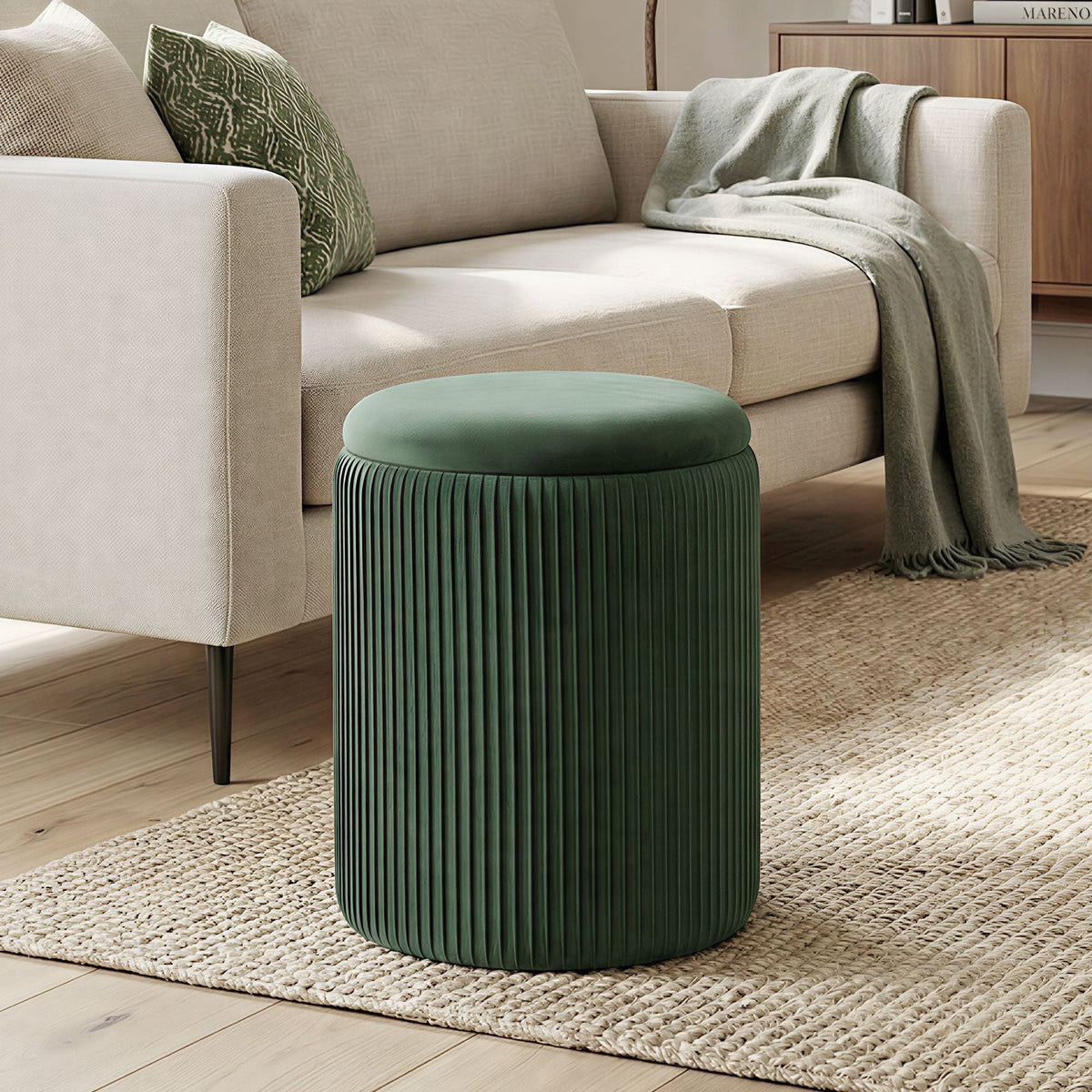 Dark green velvet storage ottoman with vertical pleats and round cushioned top for living room or bedroom seating