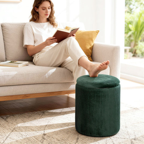 Dark green velvet storage ottoman with ribbed texture and round top perfect for living room ottoman storage bench