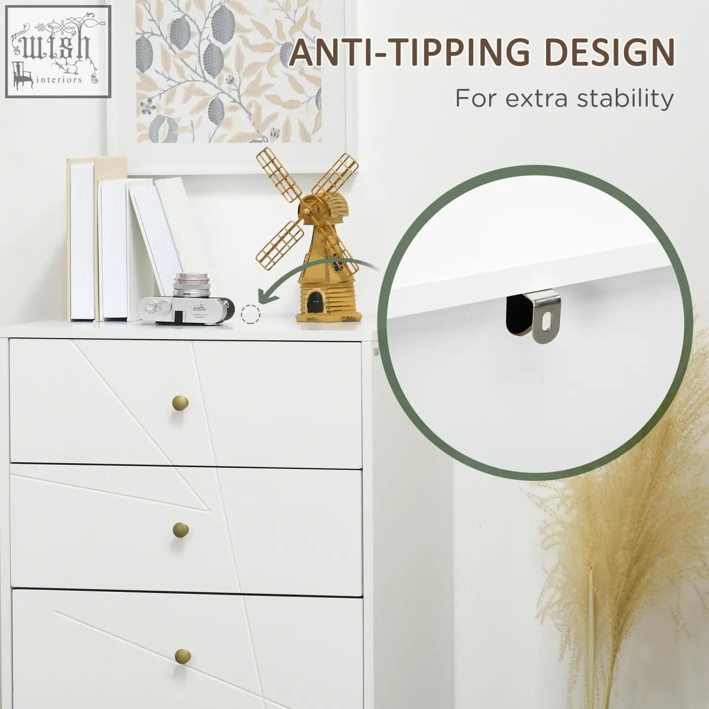 Gold wooden windmill decorative figurine with lattice blades and small doorway displayed on clean white dresser with hairpin-shaped metal legs