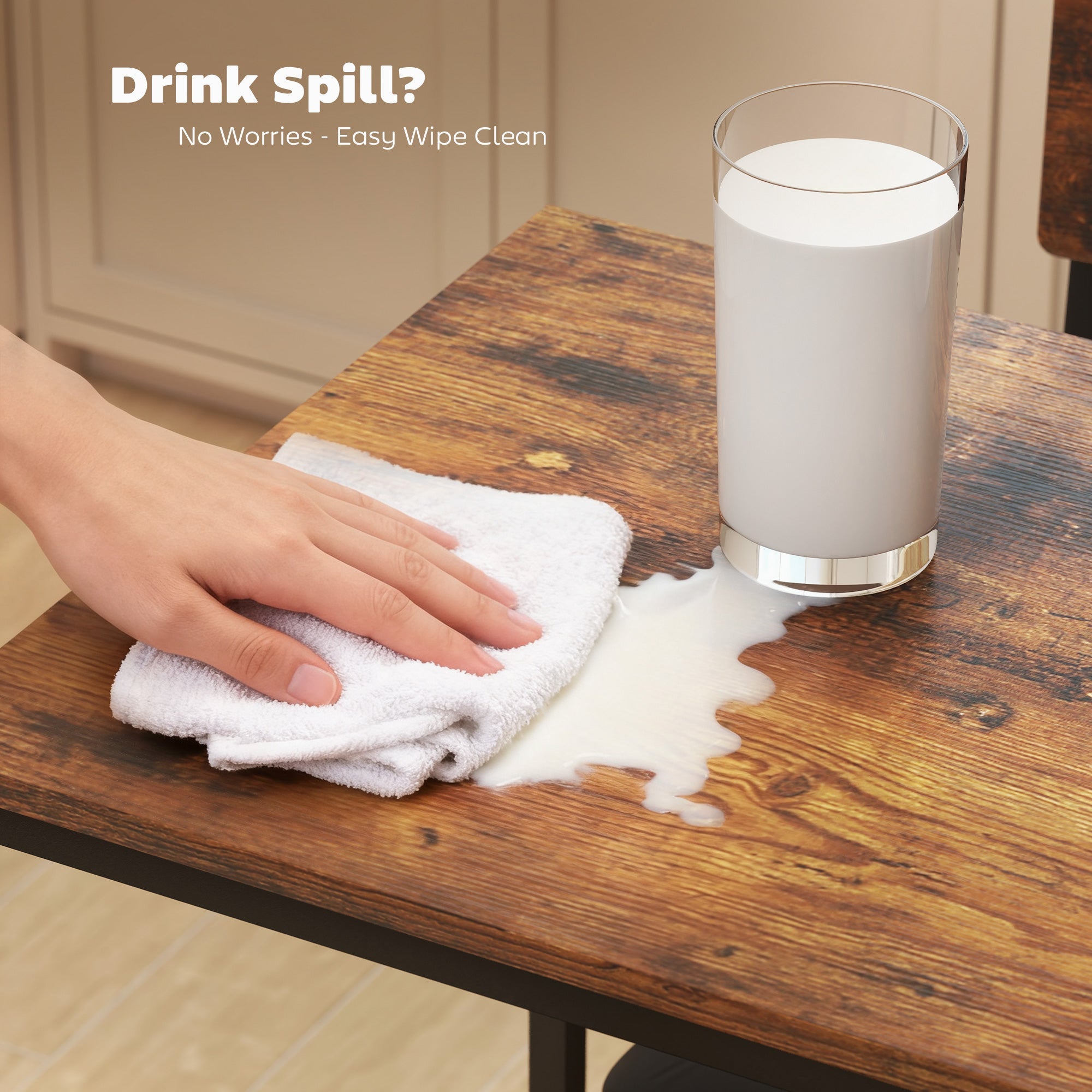 A clear glass tumbler with silver base filled with milk on brown black homcom bar table set to save space