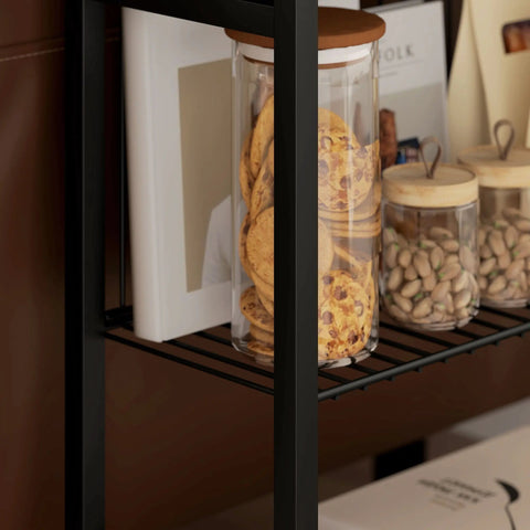 Tall clear glass jar with wooden lid filled with cookies on black homcom three shelf industrial side table with handy adjustable feet