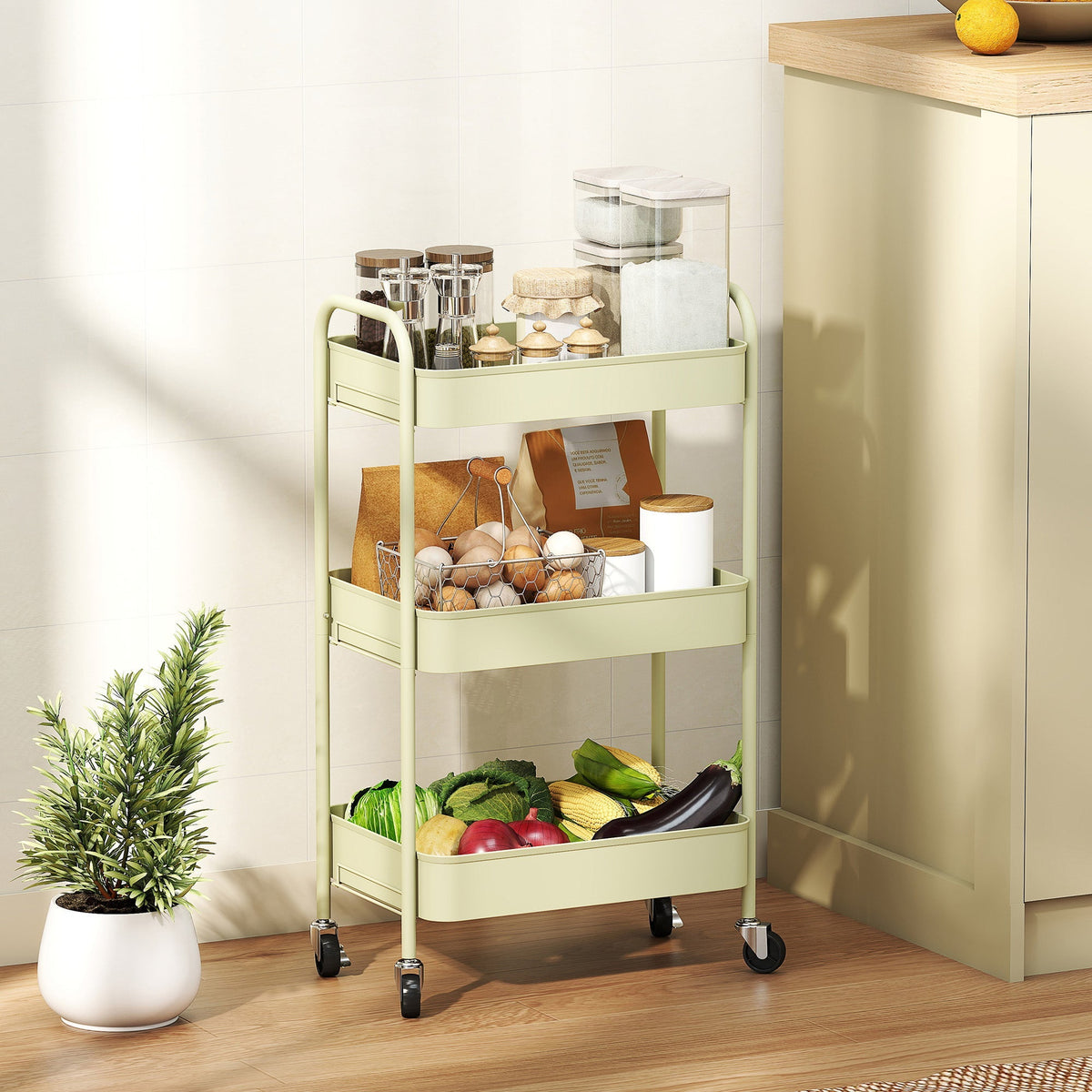 Green homcom three-tier steel utility cart with four wheels large basket holding kitchen items and fresh produce