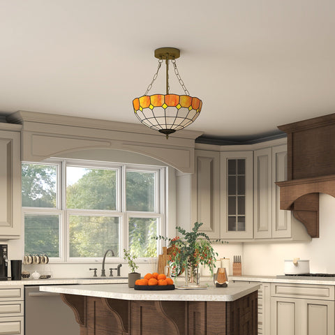 Orangish-yellow stained glass tiffany style ceiling light with brass mount and three e27 bulb sockets for living room