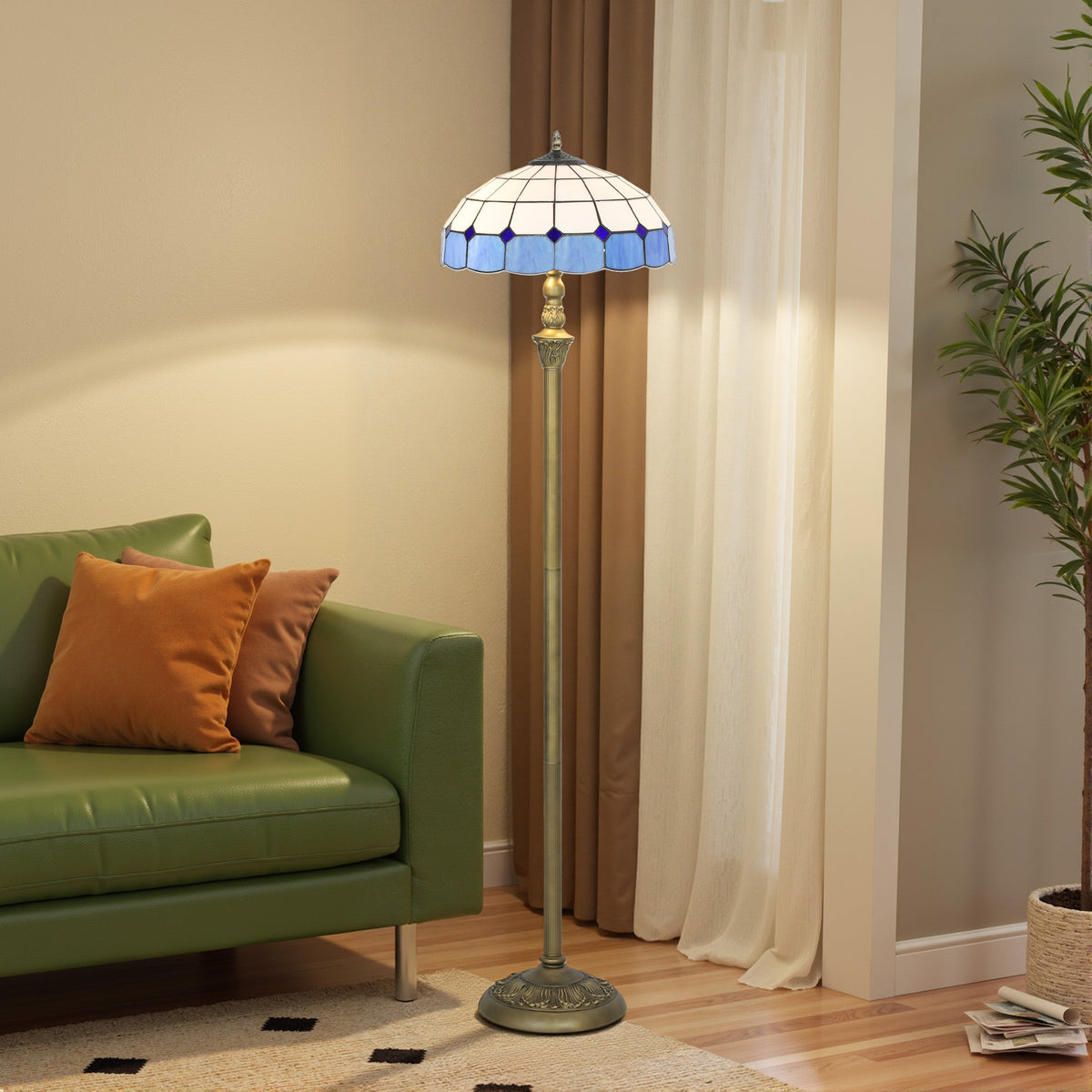 Blue and white stained glass tiffany-style floor lamp with brass base and foot switch for living room or bedroom