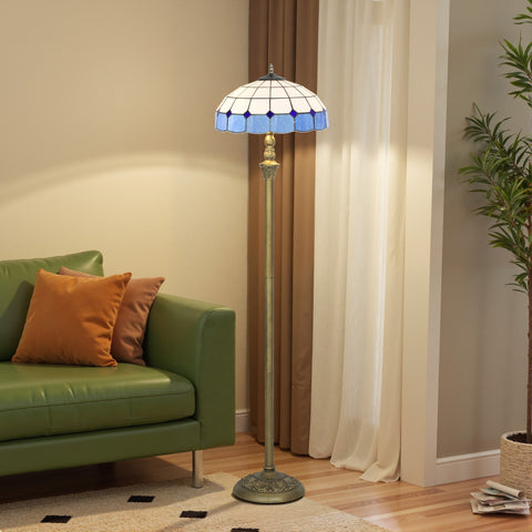 Blue and white stained glass tiffany-style floor lamp with brass base and foot switch for living room or bedroom