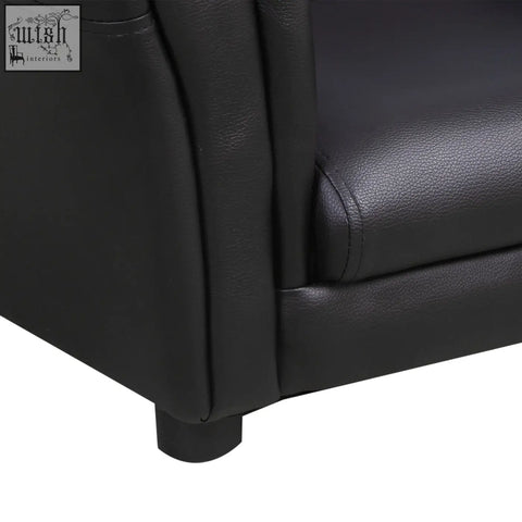 Black faux leather kids sofa with stitched seams and padded textured surface for extra comfort from HOMCOM