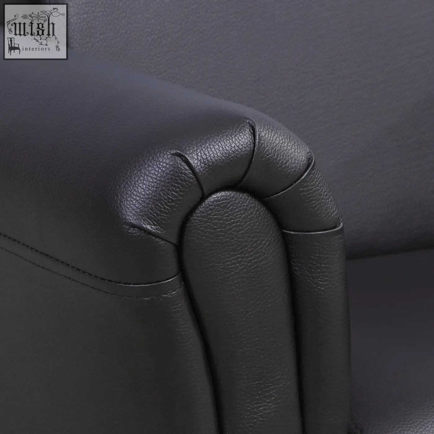 Black leather armrest with pebbled texture and stitching on homcom kids sofa set for extra comfort