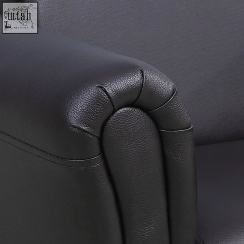Black leather armrest with pebbled texture and stitching on homcom kids sofa set for extra comfort