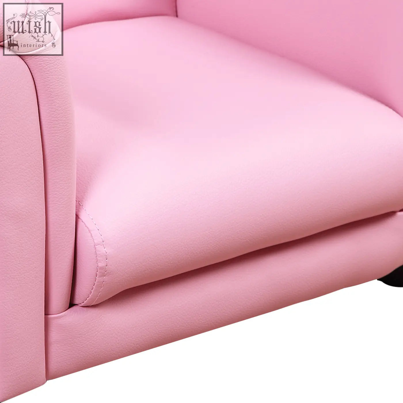 Pink faux leather kids sofa chair with smooth padded upholstery and clean stitching for extra comfort in toddler use