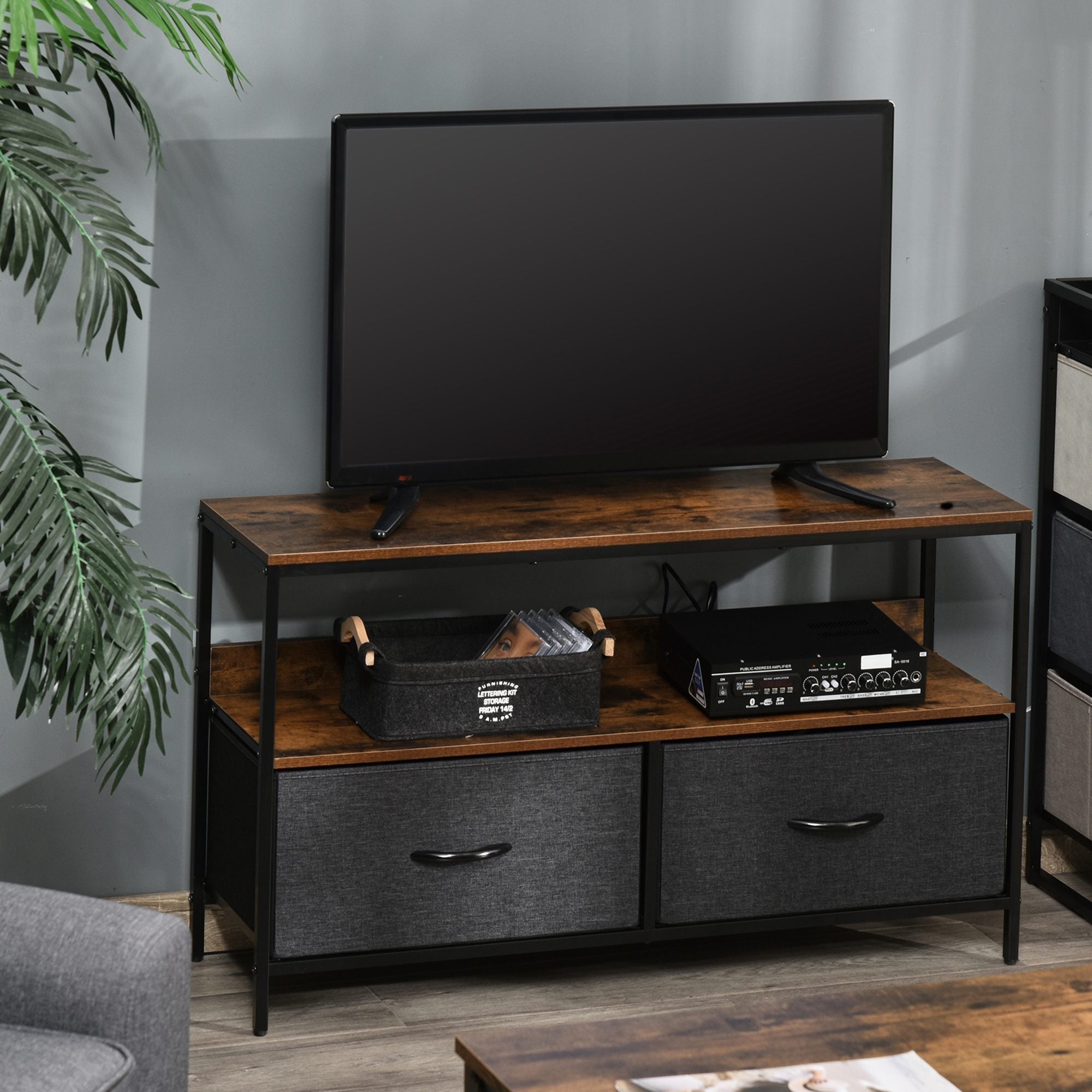Industrial-style homcom tv stand with rustic brown wood top, black metal frame, and gray fabric drawers for living room or entertainment room