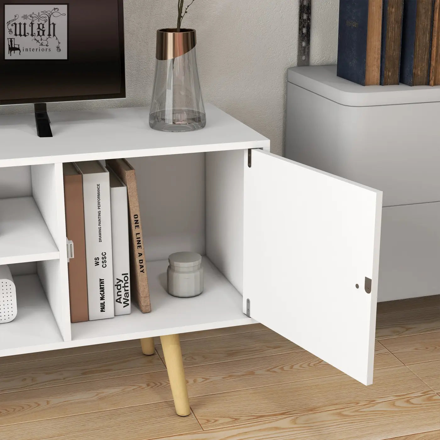 White modern media console with open shelving and wood legs provides large storage space for living room or bedroom
