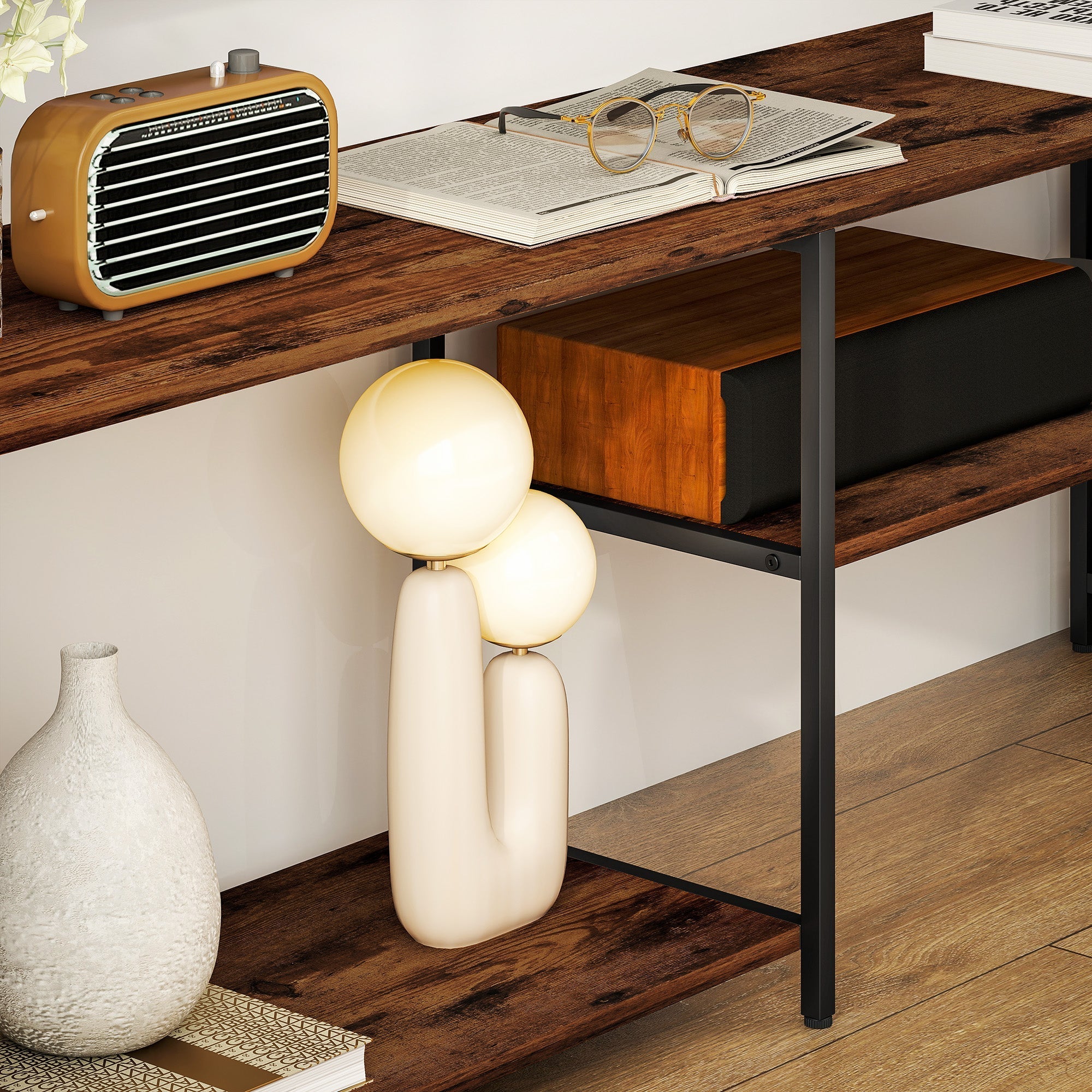 Cream-colored sculptural table lamp with two bulbs on homcom industrial tv unit with steel frame for uneven floors
