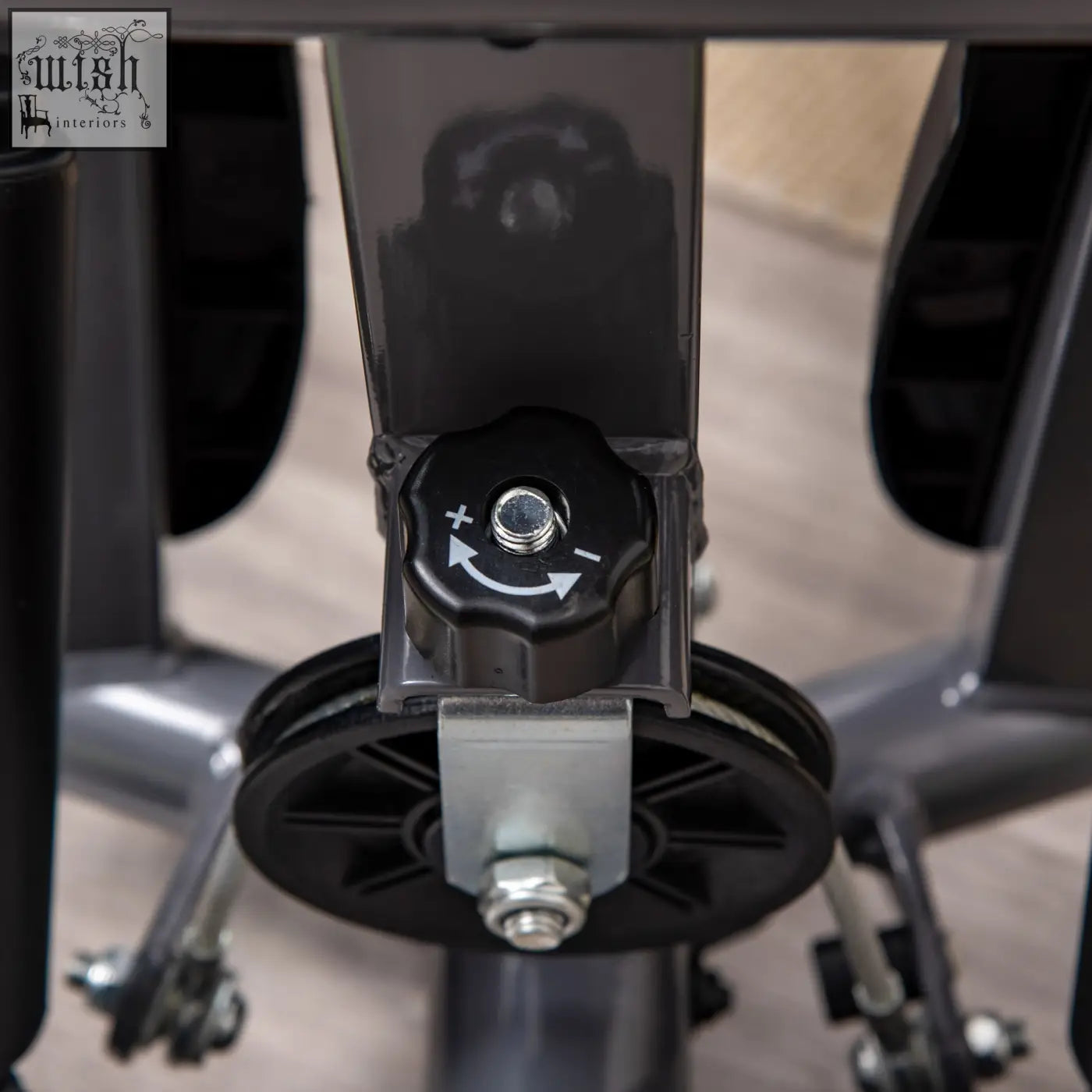 Black plastic adjustment knob with arrows and metal screw on grey homcom twister stepper for lower body and lcd monitor use