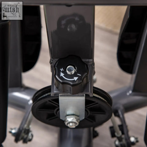 Black plastic adjustment knob with arrows and metal screw on grey homcom twister stepper for lower body and lcd monitor use