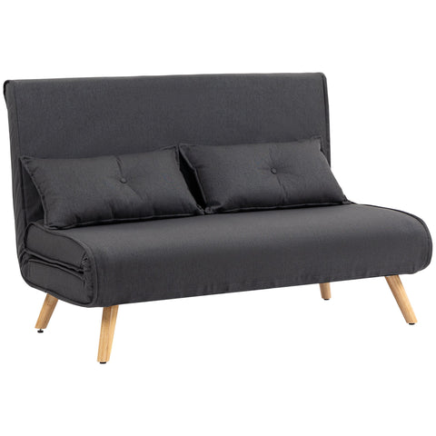Dark gray linen-look sofa bed with wooden legs and tufted pillows featuring a click-clack mechanism and high-density foam