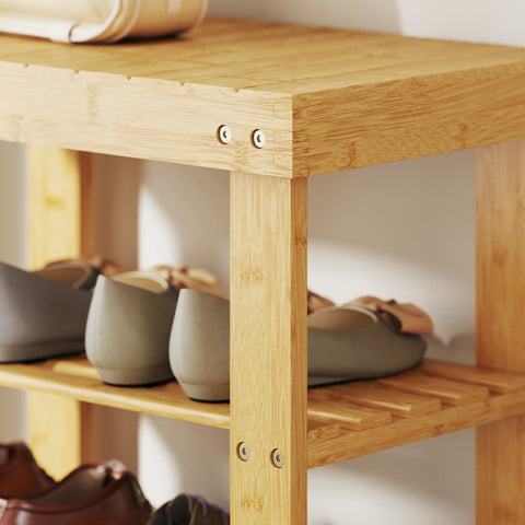 Natural finish homcom shoe bench with two slatted shelves made of light bamboo and visible screws at the joints