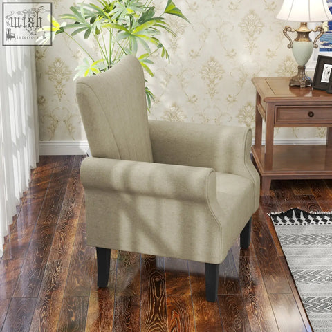Beige upholstered accent chair with curved rolled arms and wooden frame legs for cozy seating