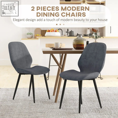 Modern dining chairs with dark gray velvet upholstery and black powder coated steel legs for dining room use