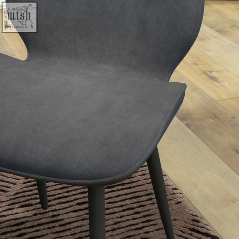 Modern gray upholstered dining chairs with sleek design and powder coated steel legs for living and dining room