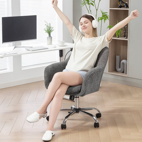 Gray velvet-feel office chair with chrome base and black casters featuring a swivel seat for 360° comfort