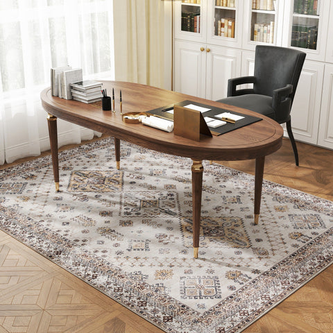 Elegant oval wooden desk with brass legs on a beige homcom area rug offering plush comfort underfoot in living room