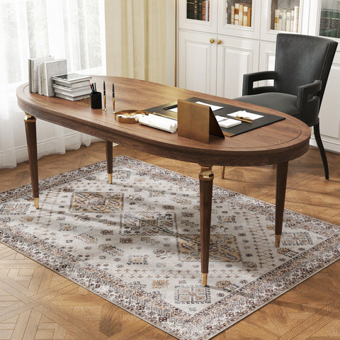 Elegant oval wooden desk with dark brown finish on plush beige area rug offering plush comfort underfoot in living room