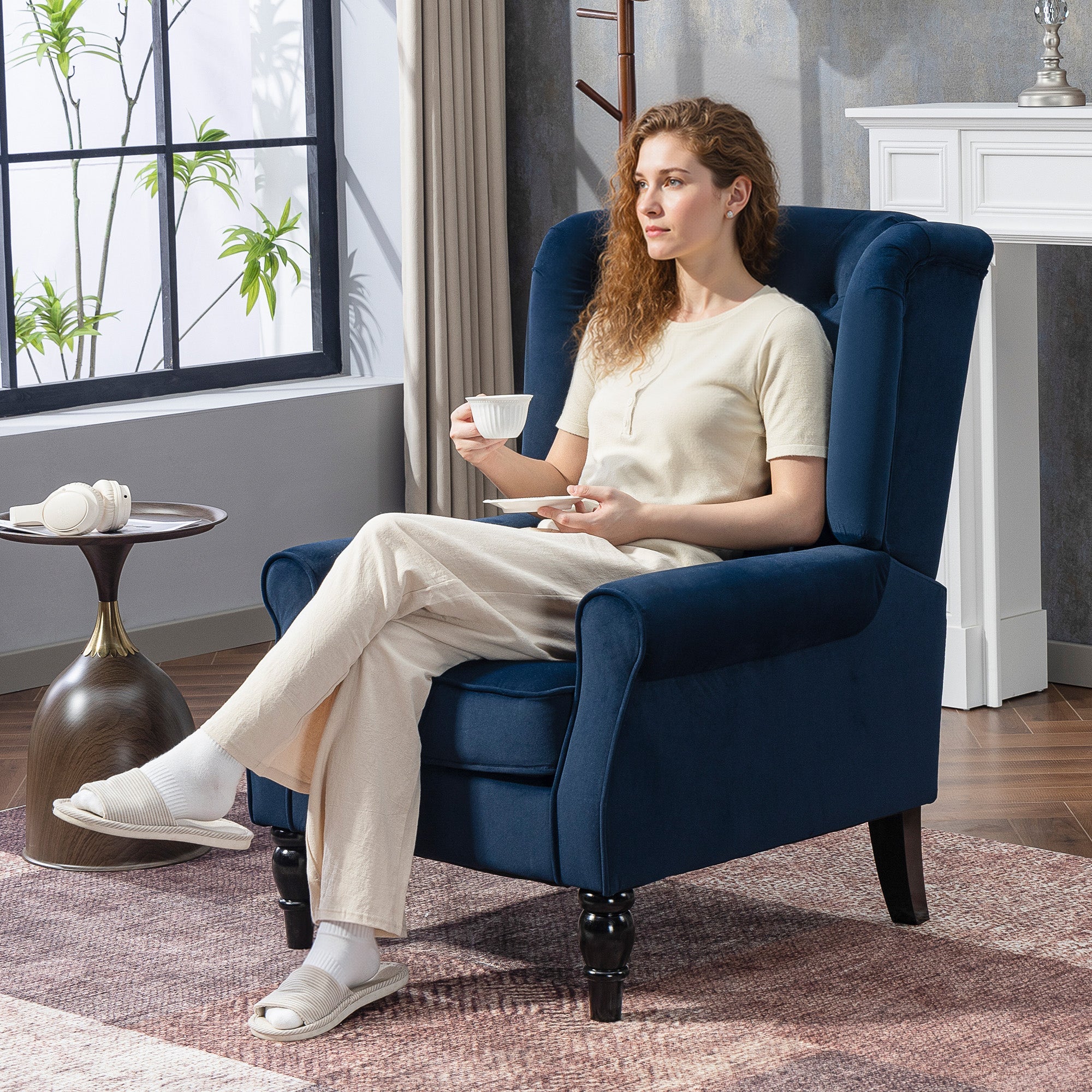 Deep blue velvet accent chair with tufted upholstery and dark wooden legs perfect for living room floor height seating