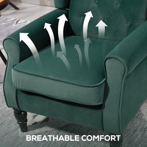 Deep emerald green velvet accent chair with tufted back and rolled arms on dark wooden floor height legs