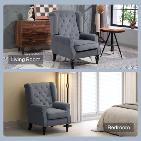 Gray tufted wingback accent chair with dark wooden legs and retro button tufted upholstery perfect for floor height seating