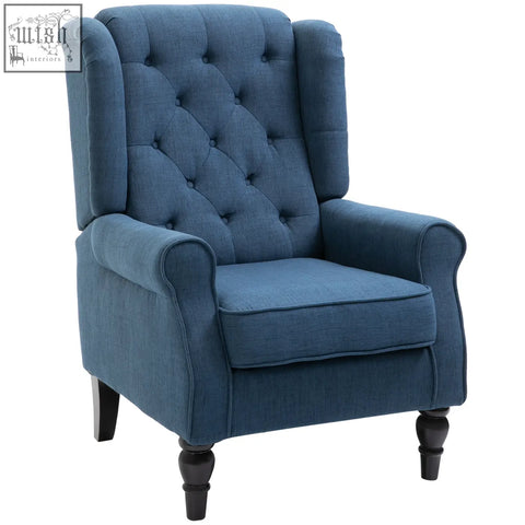 Deep blue tufted wingback accent chair with rolled arms and dark wooden legs perfect for living room floor height seating