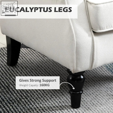 Black eucalyptus legs with turned design supporting cream white homcom wingback accent chair wooden frame