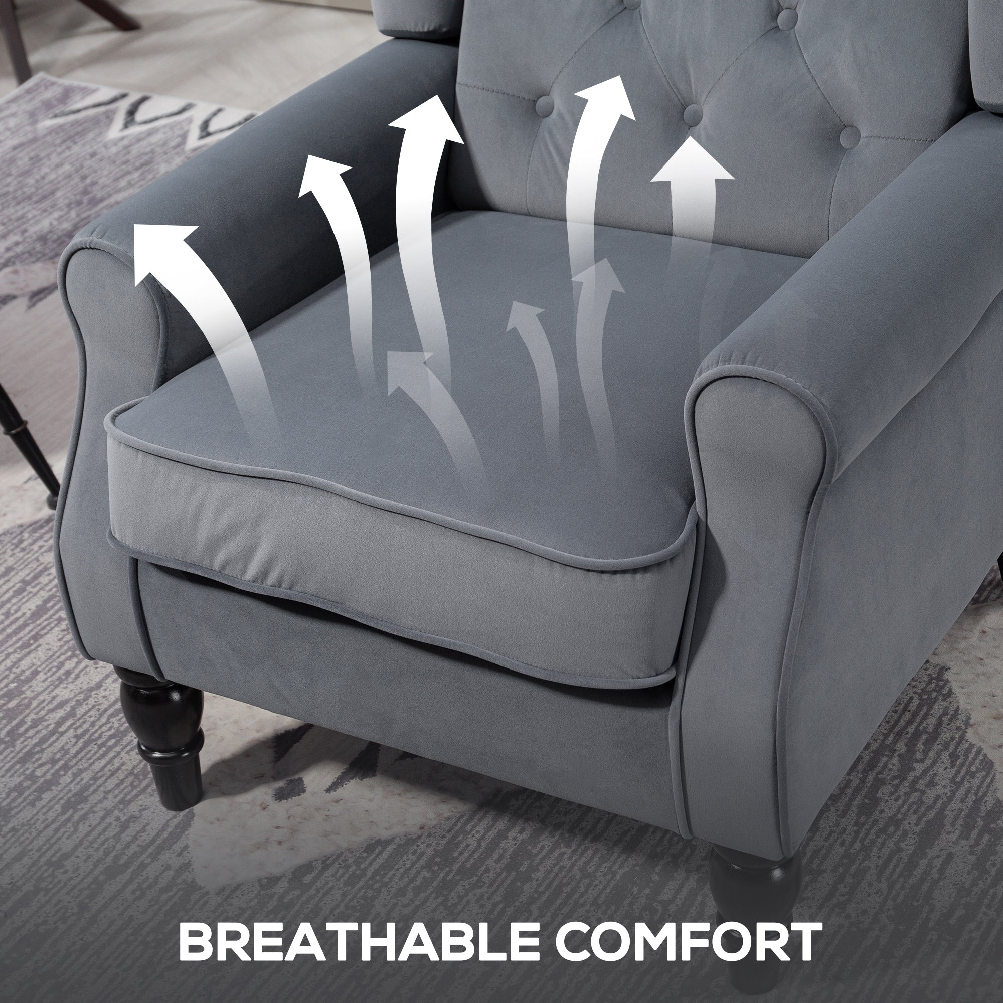Gray tufted velvet wingback accent chair with black wooden legs and comfortable floor height for living room or bedroom