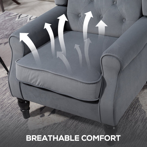Gray tufted velvet wingback accent chair with black wooden legs and comfortable floor height for living room or bedroom