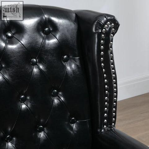 Black HOMCOM wingback accent chair with tufted leather seat cushion and eucalyptus wood frame for living room or bedroom