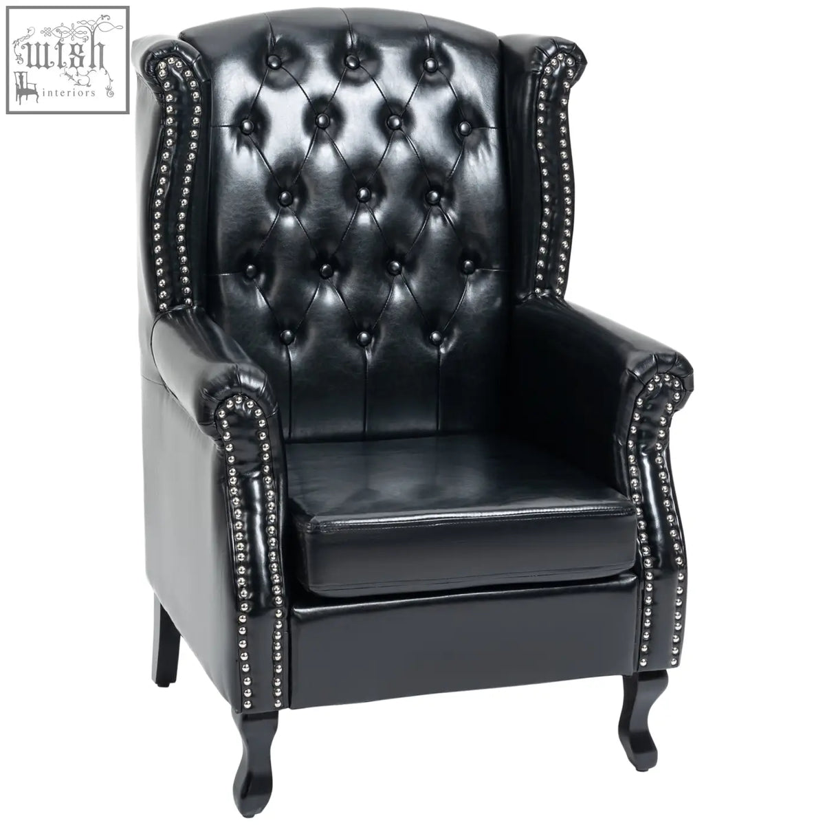 Black leather wingback armchair with tufted seat cushion and silver nailhead trim on eucalyptus wood frame for living room