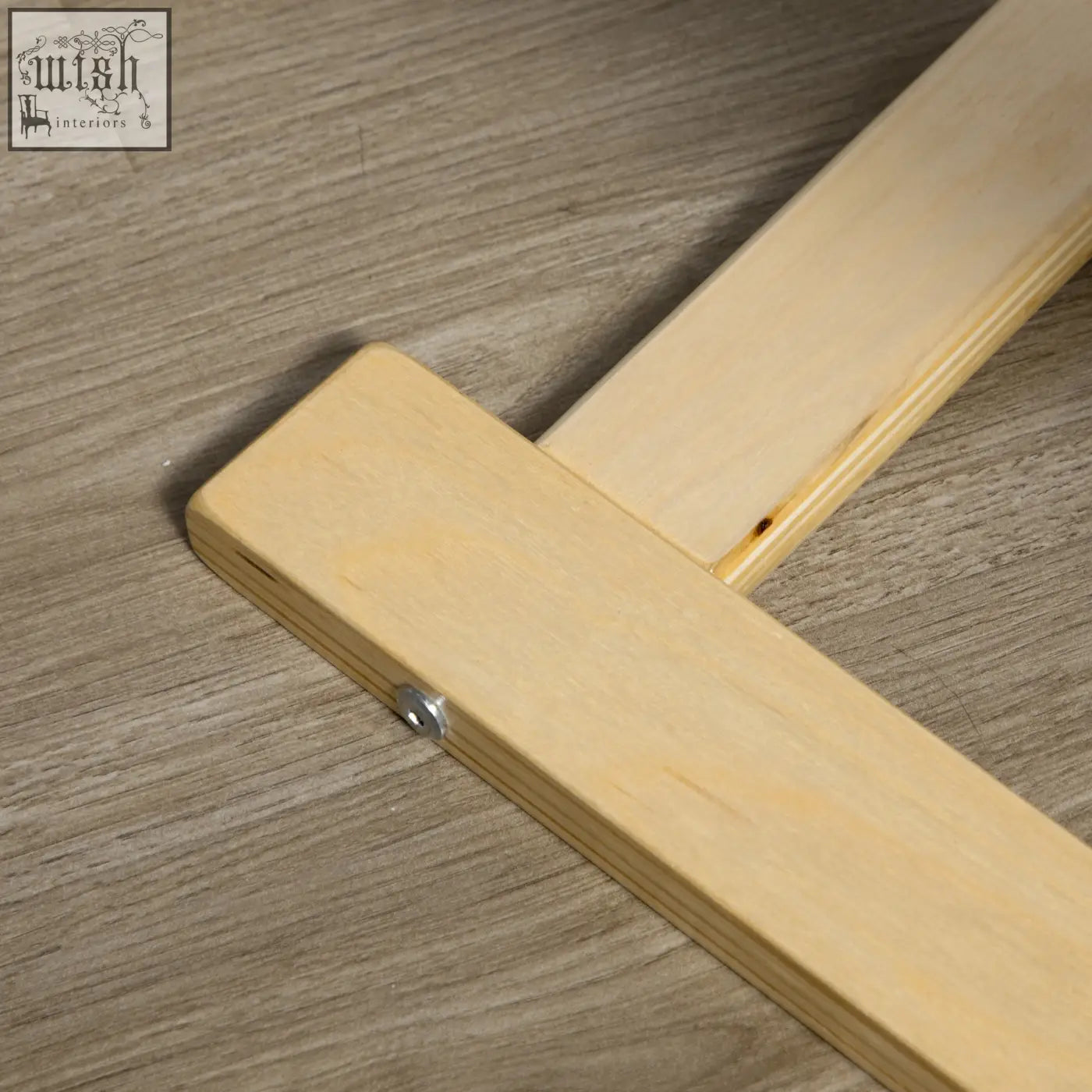 Light-colored birch wood frame folding easel with visible wood grain and minimalist design for easy setup