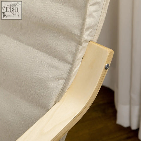 Beige linen-upholstered lounging chair with birch wood frame and adjustable footrest for relaxing deck use