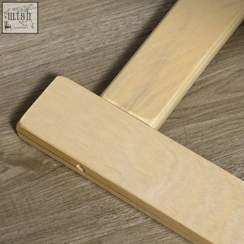 Light-colored birch wood t-square with smooth finish on the birch wood frame of homcom wooden lounging chair