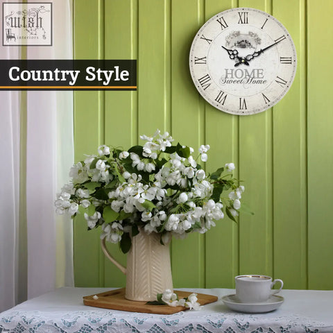 Cream-colored ceramic pitcher with ribbed texture and handle featured in home sweet home wall clock décor