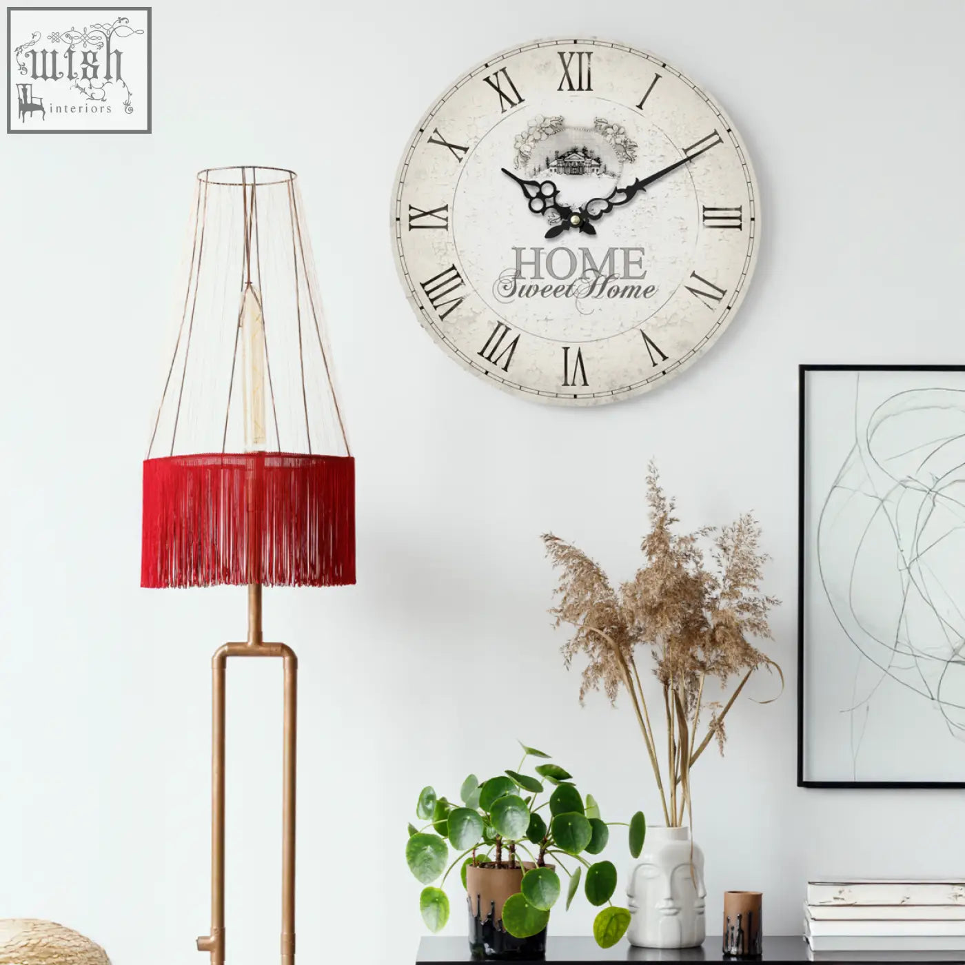 Vintage-style home sweet home wall clock with distressed off-white face black roman numerals and elegant script design