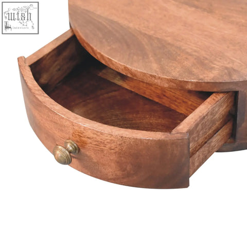 A warm honey caramel finish rounded bedside table with a medium brown wooden top and a curved drawer with brass knob